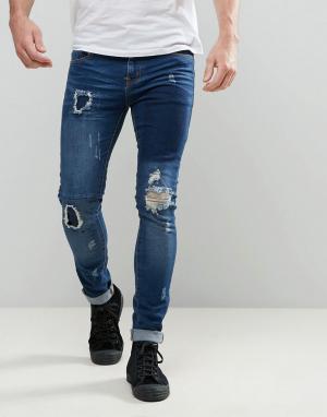 Темные супероблегающие джинсы с заплатками Dexter Always Rare. Цвет: синий