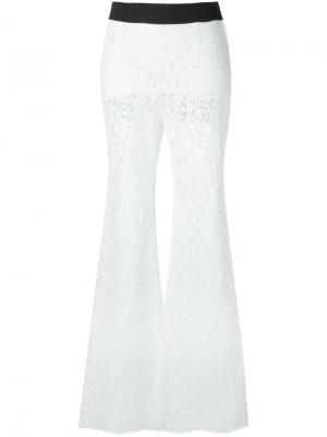 Расклешенные кружевные брюки Dolce & Gabbana. Цвет: белый