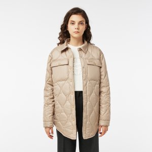Верхняя одежда Женская стёганая куртка Lacoste. Цвет: бежевый