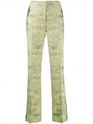 Расклешенные брюки с цветочным узором Moschino. Цвет: зеленый