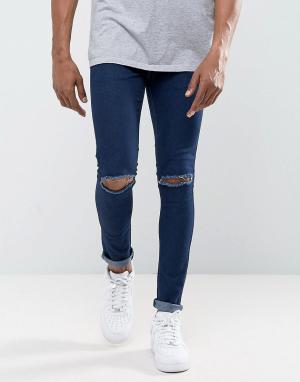 Супероблегающие джинсы с дырками на коленях Criminal Damage. Цвет: синий