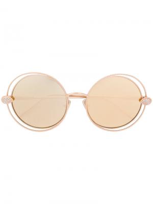 Солнцезащитные очки в круглой оправе Boucheron Eyewear. Цвет: золотистый