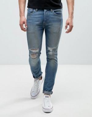 Выбеленные джинсы скинни с рваными коленями 501 Levis. Цвет: синий