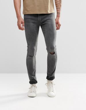 Супероблегающие рваные джинсы 519 Levis Line 8. Цвет: серый
