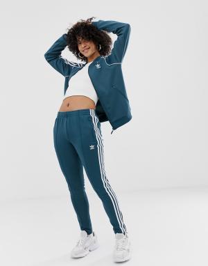 Колготки с 3 полосками Adidas Originals. Цвет: синий