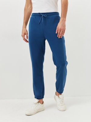 Спортивные брюки Just Clothes. Цвет: синий