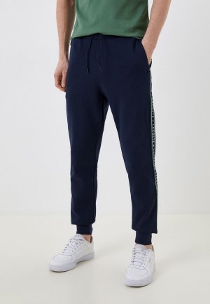 Брюки спортивные Lacoste. Цвет: синий