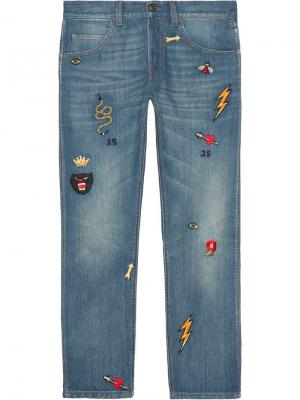 Зауженные джинсы с нашивками Gucci