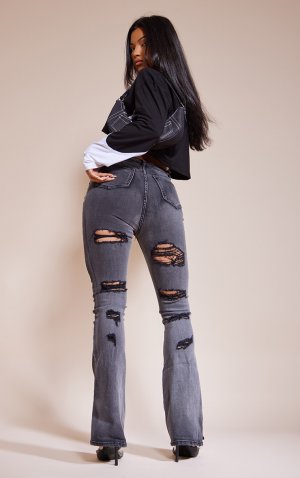 Выстиранные черные расклешенные джинсы с высокой посадкой и потертостями на спине PrettyLittleThing