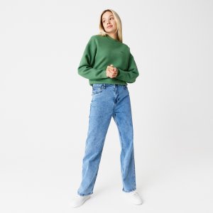 Брюки и шорты Женские джинсы Regular Fit Lacoste. Цвет: голубой
