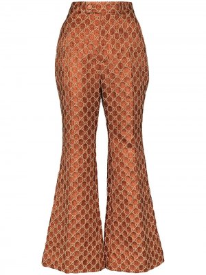 Расклешенные жаккардовые брюки с узором GG Supreme Gucci. Цвет: оранжевый