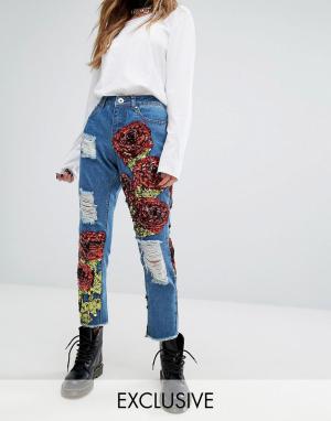 Рваные джинсы с нашивками в виде роз из пайеток One Above Another. Цвет: синий