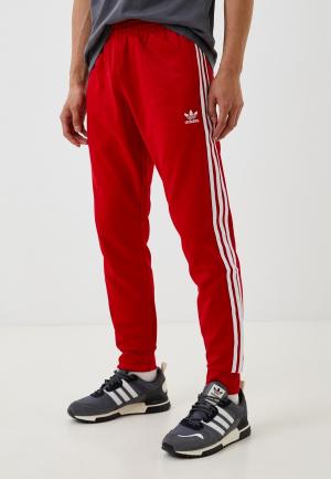 Брюки спортивные adidas Originals SST TP. Цвет: красный