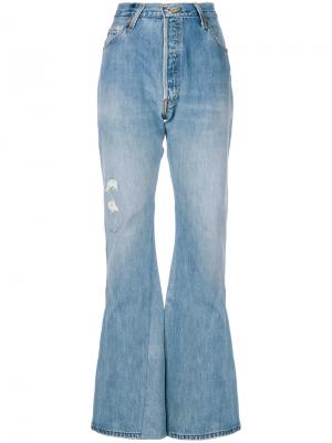 Расклешенные джинсы с рваными деталями Re/Done. Цвет: синий