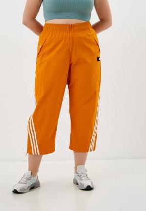 Брюки спортивные adidas W FI 3S WVN PNT. Цвет: оранжевый